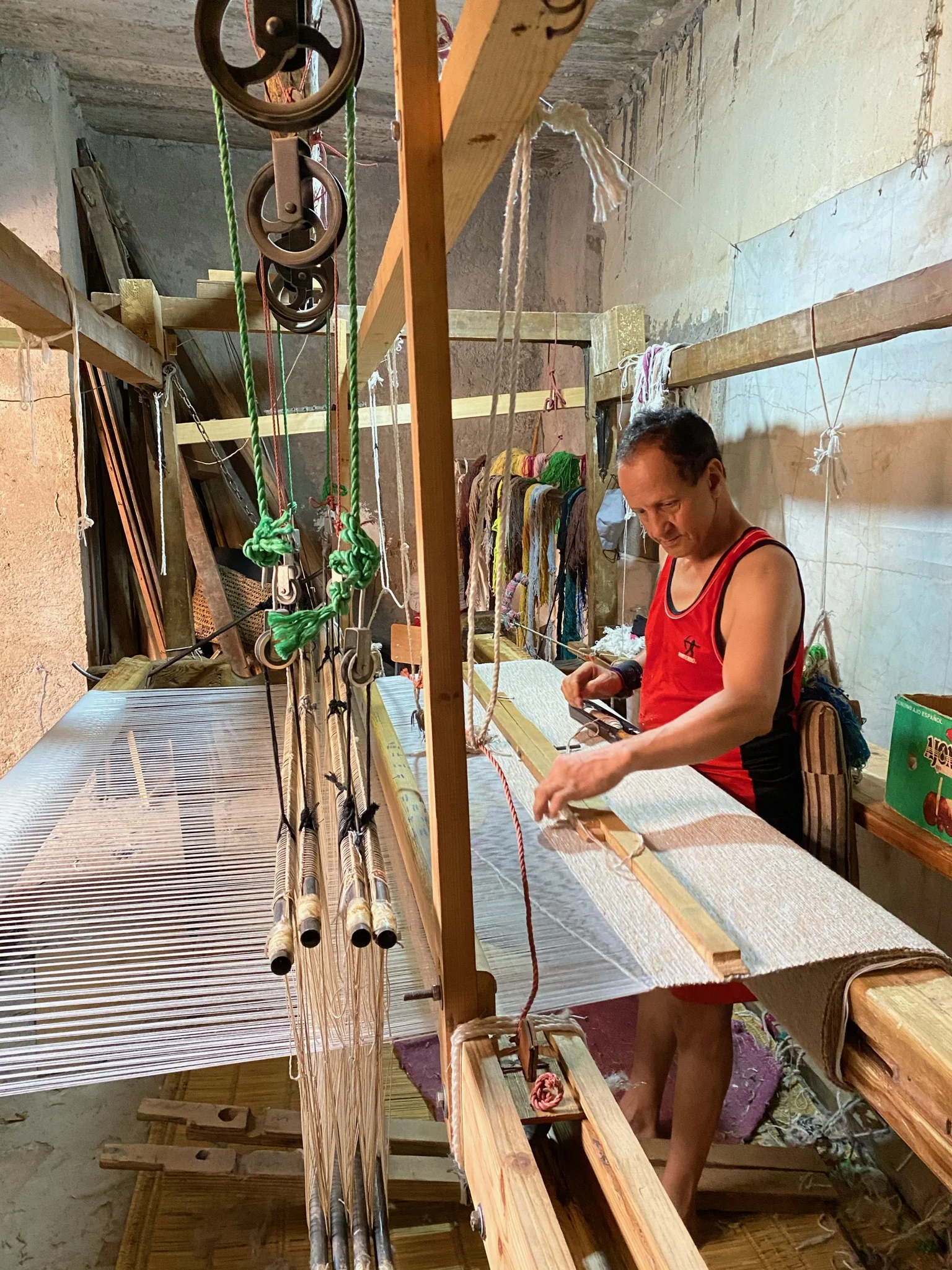 Artisan working at a traditional loom in Marrakesh