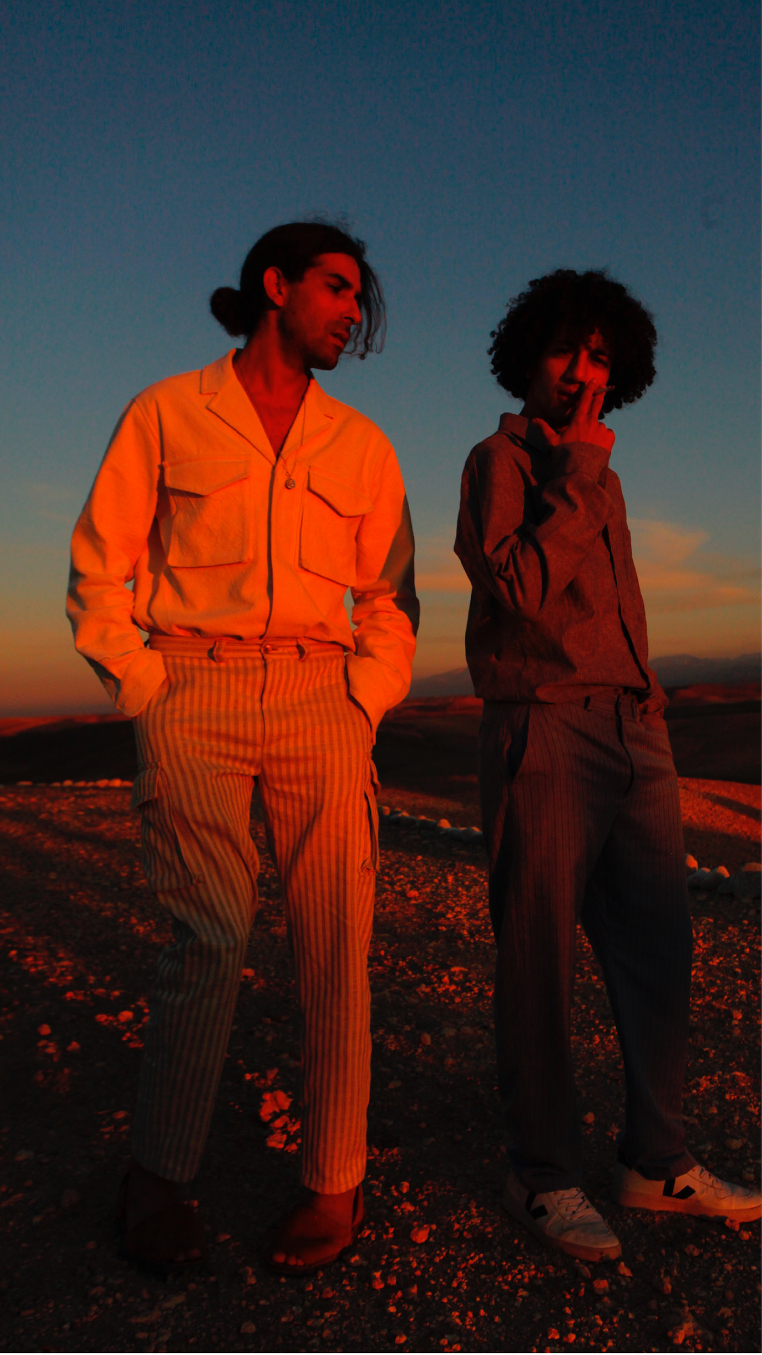 Two friends at dusk in the desert