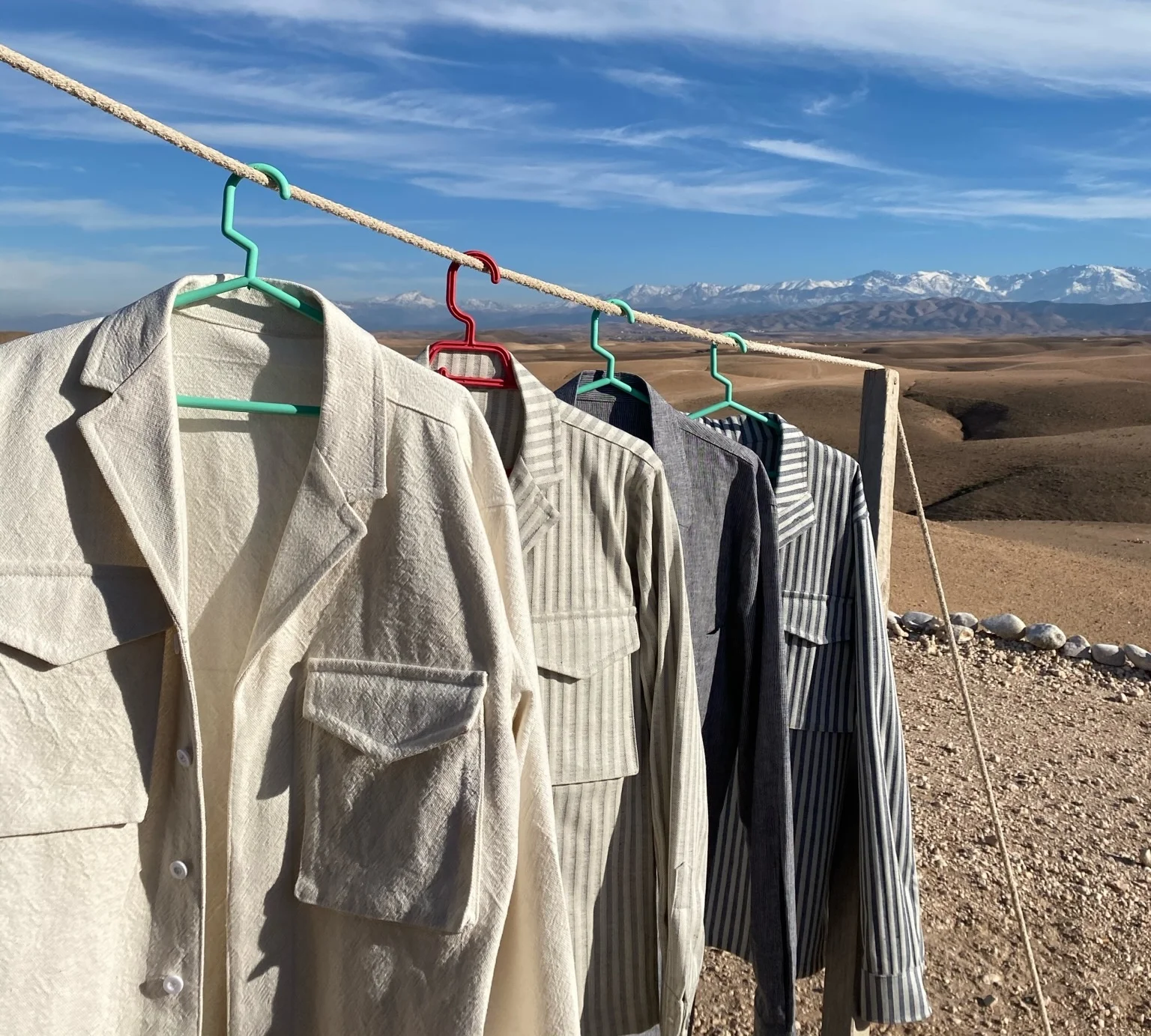 Shirts hanging on a line with the Atlas mountains